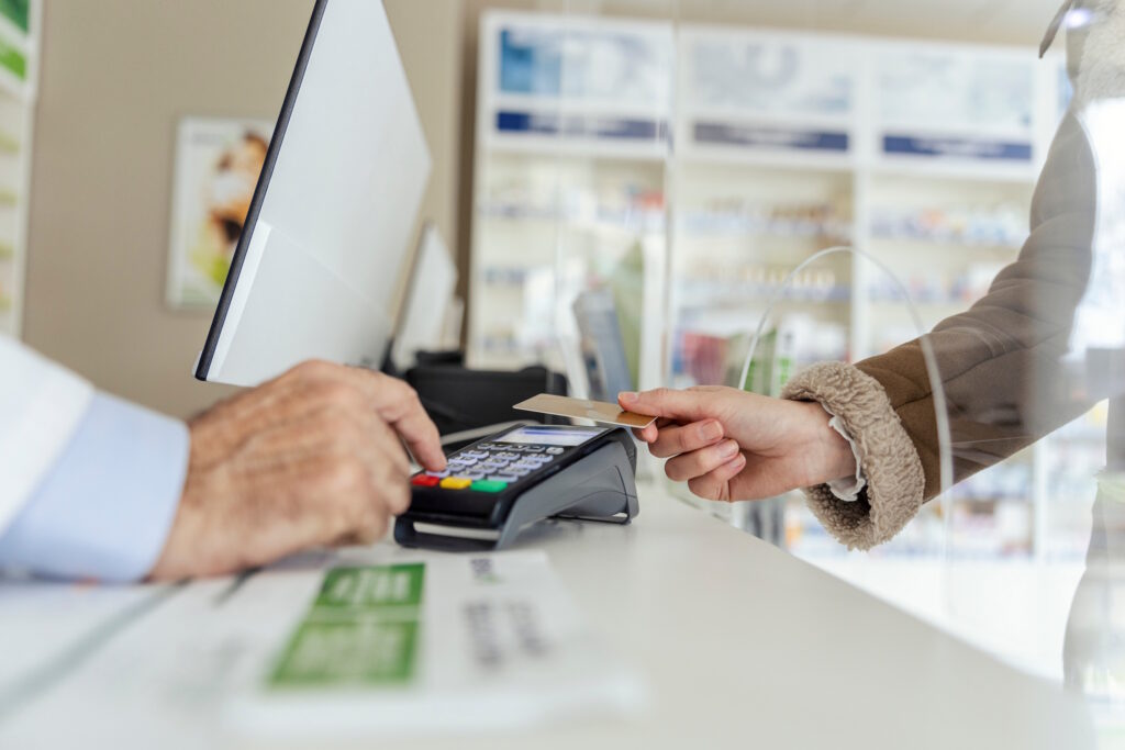 individual paying for an appointment with a card