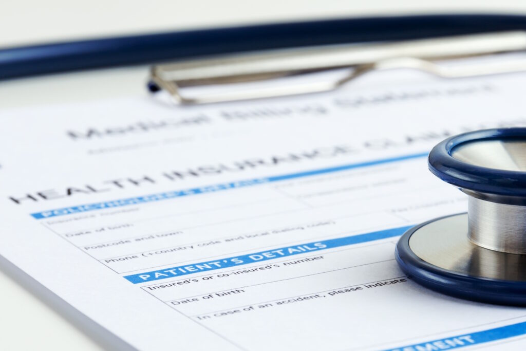 insurance paperwork with a stethoscope